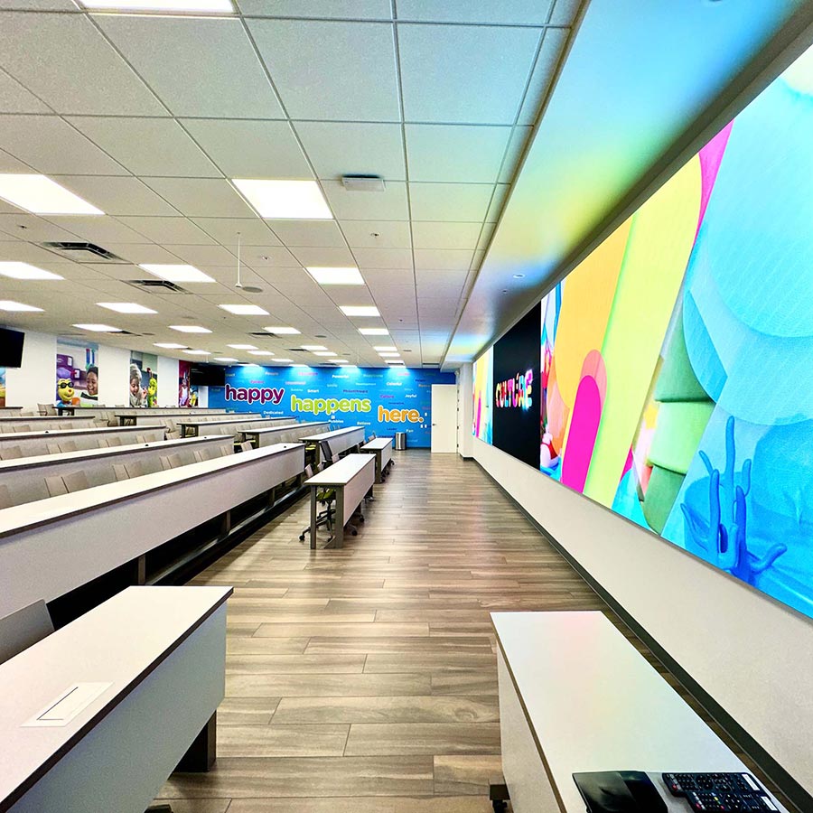 Bright home theater with a large LED wall and neutral furniture