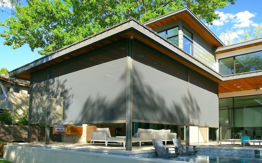 Zen advanced motorized shades from Screen Innovations surround a patio.